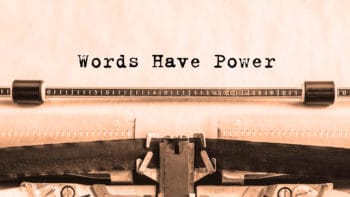 Words Have Power printed on paper on a vintage typewriter.